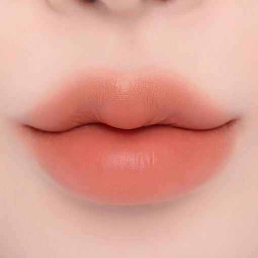 ProtoClinical k-beauty espoir Nowear Lipstick Volume Matte 3g (8 colors) close-up of centered lips with a soft blurred gradient and warm peach-beige lip color