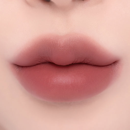 ProtoClinical k-beauty espoir Nowear Lipstick Volume Matte 3g (8 colors) close-up of centered lips with a soft blurred gradient and muted mauve-rose lip color
