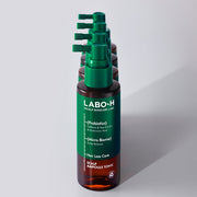 ProtoClinical k-beauty LABO-H Scalp Strengthening Clinic Ampoule Tonic Hair Loss Care 100ml shown as amber bottles with green pumps lined up behind the front bottle on a white background