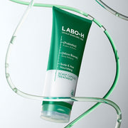 ProtoClinical k-beauty LABO-H Scalp Strengthening Clinic Capsule Treatment Hair Loss Care 220ml tube shown at an angle with green and white packaging framed by translucent lab tubing