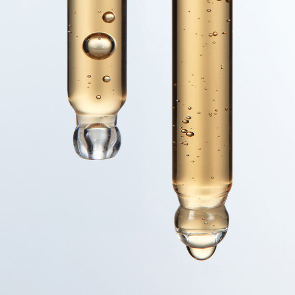 ProtoClinical k-beauty LABO-H Scalp Strengthening Clinic Hair Line Ampoule Hair Loss Care 15ML shown as amber liquid in two clear glass droppers in a close-up texture shot
