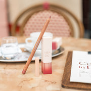ProtoClinical k-beauty skincare product collage in warm beige and blush tones on a light background.