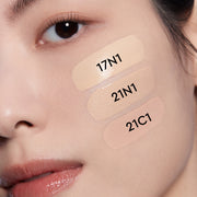 ProtoClinical k-beauty HERA Black Cushion Foundation SPF34/PA++ 15gx2 [Cushion+refill] shade 21N1 VANILLA multi-tone foundation texture close-up on a soft beige background.