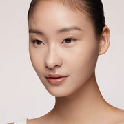 ProtoClinical k-beauty HERA Creamy Cover Concealer 7.5g 13N1 PORCELAIN concealer detail with soft beige tones and dark brown accents on a light background.