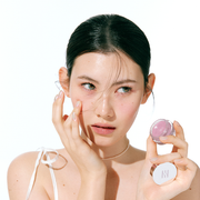 ProtoClinical k-beauty HERA Sensual Lip & Cheek 7g model portrait featuring rosy lip and cheek makeup on a light background.