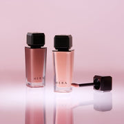 ProtoClinical k-beauty HERA Sensual Nude Gloss 5g glossy lip color detail in warm rosy tones on a light background.