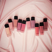 ProtoClinical k-beauty HERA Sensual Powder Matte Liquid 5g horizontal mauve and pink makeup bands on a light background.