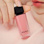 ProtoClinical k-beauty HERA Sensual Powder Matte Liquid 5g soft pink and beige makeup detail on a light background.