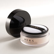ProtoClinical k-beauty HERA Soft Finish Loose Powder 15g open loose powder compact on a soft beige background.