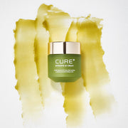 ProtoClinical k-beauty [KIM JEONG MOON Aloe] Cure Plus Intensive 2X Cream 50g as a single yellow-green cream package shown at a slight angle on a pale yellow and lavender background