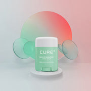 ProtoClinical k-beauty [KIM JEONG MOON Aloe] Cure Realoe Signature Stick Balm 14g as a single dark green stick balm package centered upright on a pale mint background