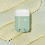 ProtoClinical k-beauty [KIM JEONG MOON Aloe] Cure Realoe Signature Stick Balm 14g as a single upright dark green stick balm package centered on a white background with pale green side accents