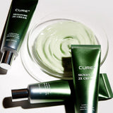 ProtoClinical k-beauty [KIM JEONG MOON Aloe] Cure+ Signature 3X Cream 50ml as a single dark green cream package centered upright with pale green side accents on a soft mauve background