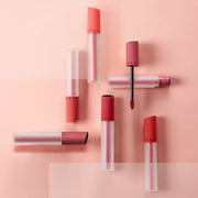 ProtoClinical k-beauty JUNGSAEMMOOL LIP-PRESSION See-Through Tint 4g warm beige lip tint silhouette on a soft blush background.