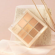 ProtoClinical k-beauty dasique Eyeshadow Palette - 12 Warm Blending shown in warm beige and peach tones on a white background.