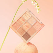 ProtoClinical k-beauty dasique Eyeshadow Palette - 14 Peach Squeeze shown in soft peach and coral tones on a white background.
