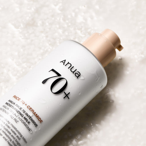 ProtoClinical k-beauty Anua Rice 70 Intense Moisturizing Milk 150ml angled gray bottle on a pale lilac and cream background