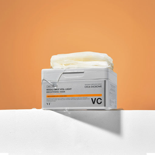 ProtoClinical k-beauty warm orange beauty product with a cool gray center shape on a light background.