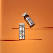 ProtoClinical k-beauty warm orange beauty graphic on a soft orange background.
