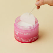 ProtoClinical k-beauty isoi Blemish Care Pad 60ea(110g) peach-toned product package with pale square blocks and a centered studio layout