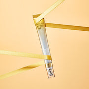 ProtoClinical k-beauty warm beige beauty product silhouette with a soft taupe vertical center on a light background.
