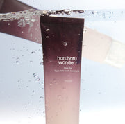 ProtoClinical k-beauty plum beauty product silhouette with a deep burgundy upper center and pale blue side accents on a light background.