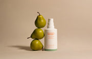 ProtoClinical k-beauty [haruharu wonder] Centella 4% TXA Dark Spot Go Away Serum 30ml single upright amber serum bottle centered on a pale cream background with soft peach shading.