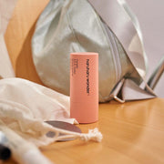 ProtoClinical k-beauty peach and beige beauty graphic with a dark brown upper band on a light background.