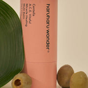 ProtoClinical k-beauty deep coral beauty graphic with muted olive side panels on a soft background.