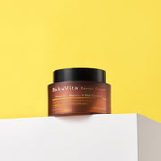 ProtoClinical k-beauty yellow beauty product silhouette with a dark olive center and a soft lavender base on a light background.