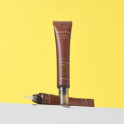 ProtoClinical k-beauty pale blue beauty product silhouette with a white center and a taupe lower section on a light background.