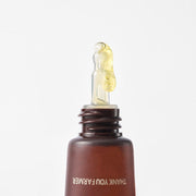 ProtoClinical k-beauty yellow beauty product silhouette with a dark gray center and a soft lavender base on a light background.