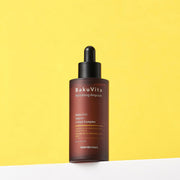 ProtoClinical k-beauty slim golden beauty bottle silhouette on a bright yellow background.