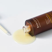 ProtoClinical k-beauty warm beige beauty detail with a deep olive circular center on a pale background.