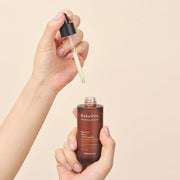 ProtoClinical k-beauty yellow beauty product silhouette with an olive center and a soft gray base on a light background.