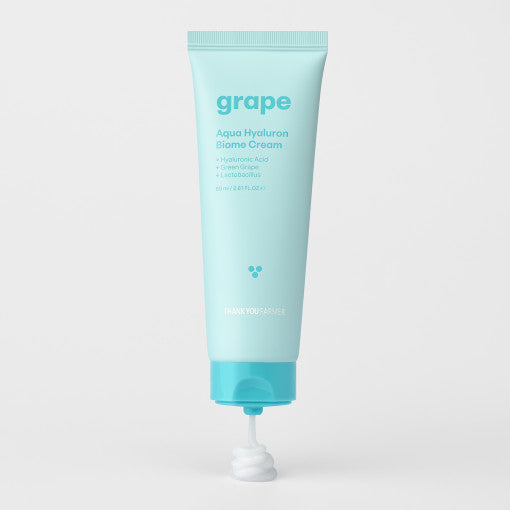 ProtoClinical k-beauty pale blue beauty bottle silhouette with soft peach side accents on a light background.