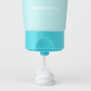 ProtoClinical k-beauty pastel beauty graphic with a teal center and soft pink and beige side accents.