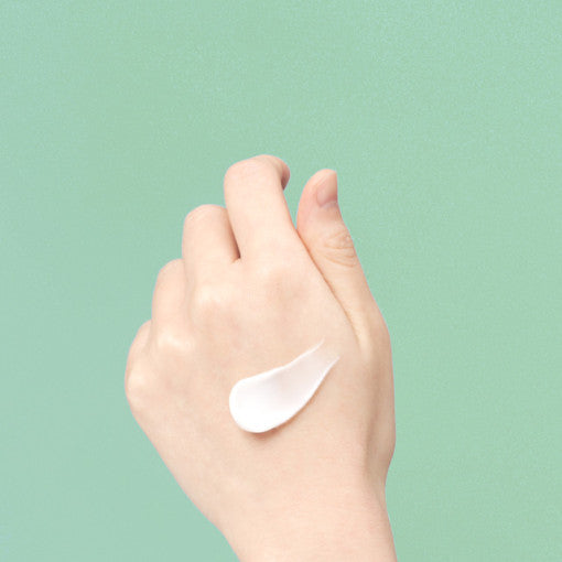 ProtoClinical k-beauty pale aqua beauty bottle silhouette with a cream center and warm beige lower accent on a light background.