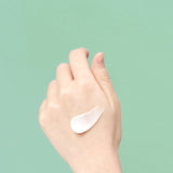ProtoClinical k-beauty pale aqua beauty bottle silhouette with a cream center and warm beige lower accent on a light background.