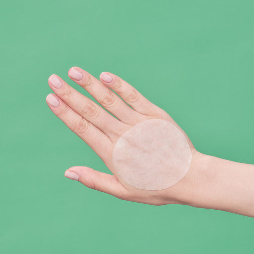 ProtoClinical k-beauty soft green beauty detail with a pale peach center on a light background.