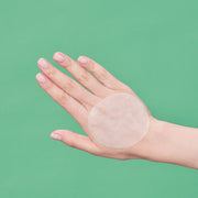 ProtoClinical k-beauty soft green beauty detail with a pale peach center on a light background.