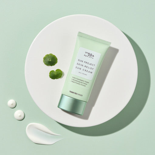ProtoClinical k-beauty [THANK YOU FARMER] Sun Project Skin Relief Sun Cream SPF50+ PA++++ 50ml single upright sun cream package in pale lavender tones on a light aqua background.