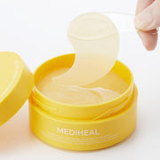 ProtoClinical k-beauty MEDIHEAL: Vita Collagen Eye Ampoule Patch 60p bright yellow eye patch package centered on a light background with pale gold side shading