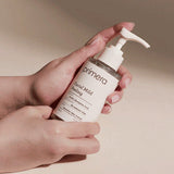 ProtoClinical k-beauty primera Facial Mild Peeling 150ml single upright beige package centered on a warm brown and pale gray background