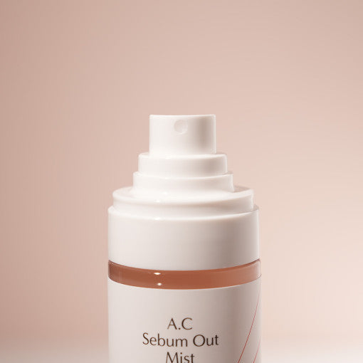ProtoClinical k-beauty pale pink beauty product detail with a soft brown lower edge on a light background.