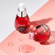 ProtoClinical k-beauty red beauty product silhouette with a pale gray base on a light background.