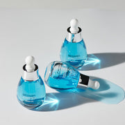 ProtoClinical k-beauty dark teal beauty product silhouette with pale aqua lower shading on a warm beige background.