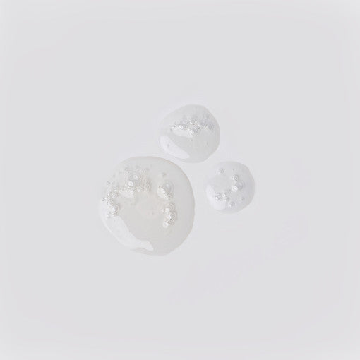 ProtoClinical k-beauty MIGUHARA Aquaporin Ampoule 30ml soft white product silhouette with an olive center on a light background