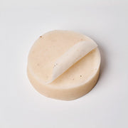 ProtoClinical k-beauty warm beige beauty product silhouette with soft blue corners on a light background.