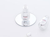 ProtoClinical k-beauty soft olive beauty product silhouette with a dark center on a light background.